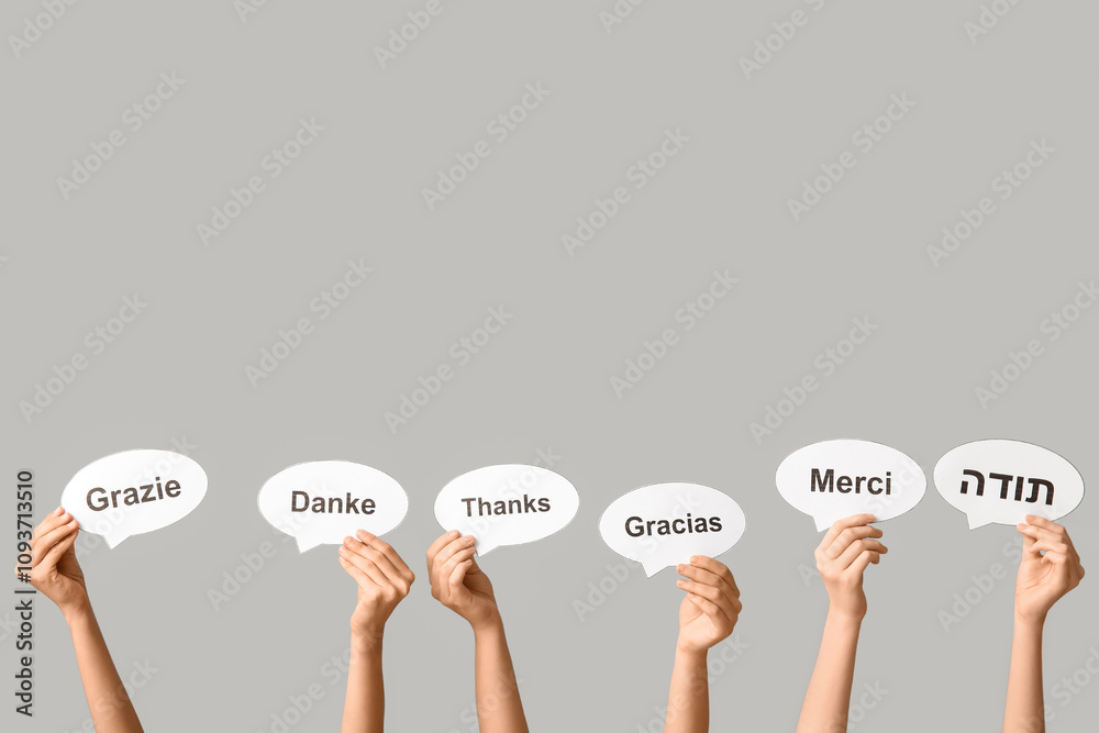 Female hands holding speech bubbles with text THANK YOU in different ...
