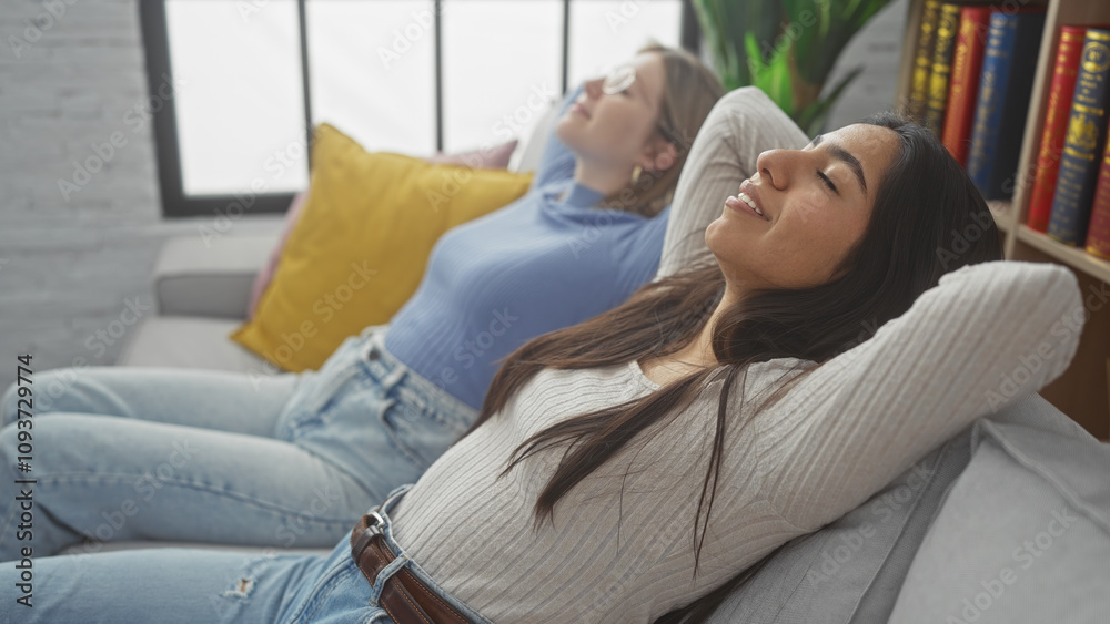 Two women relaxing together on a couch in a cozy living room, eyes closed in comfort Two women relaxing together on a couch in a cozy living room, eyes closed in comfort