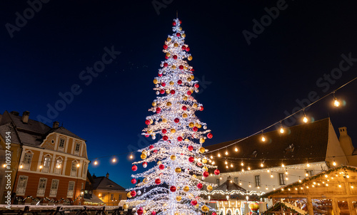 Christmas market and tree in Sibiu, Romania, snow in winter