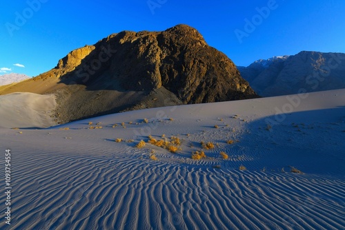 Sunset scenery of enchanting high-altitude Sarfaranga Cold Desert located near the village of Shigar (Gilgit-Baltistan, Pakistan)