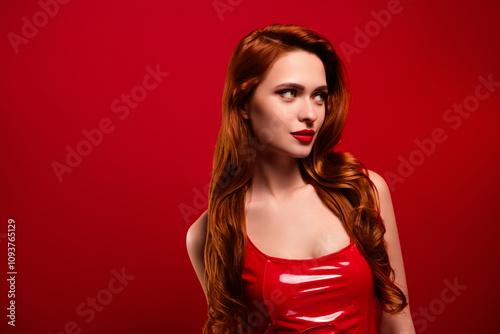Photo of attractive gorgeous woman look empty space dressed sexy leather clothes isolated on red color background