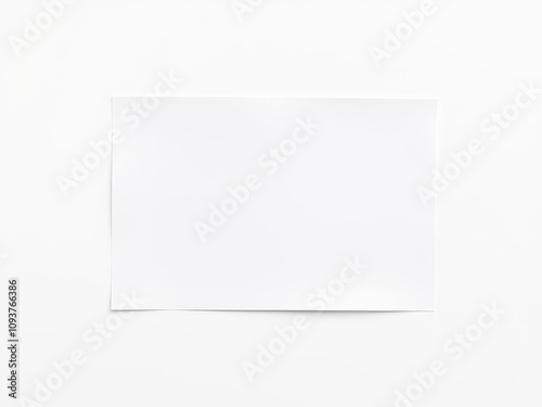 A blank sheet of paper on a clean white background, perfect for showcasing your design or message, display, template, top view