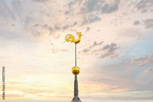 Golden Rooster Weather Vane on St. Peter's Church Spire at Sunset