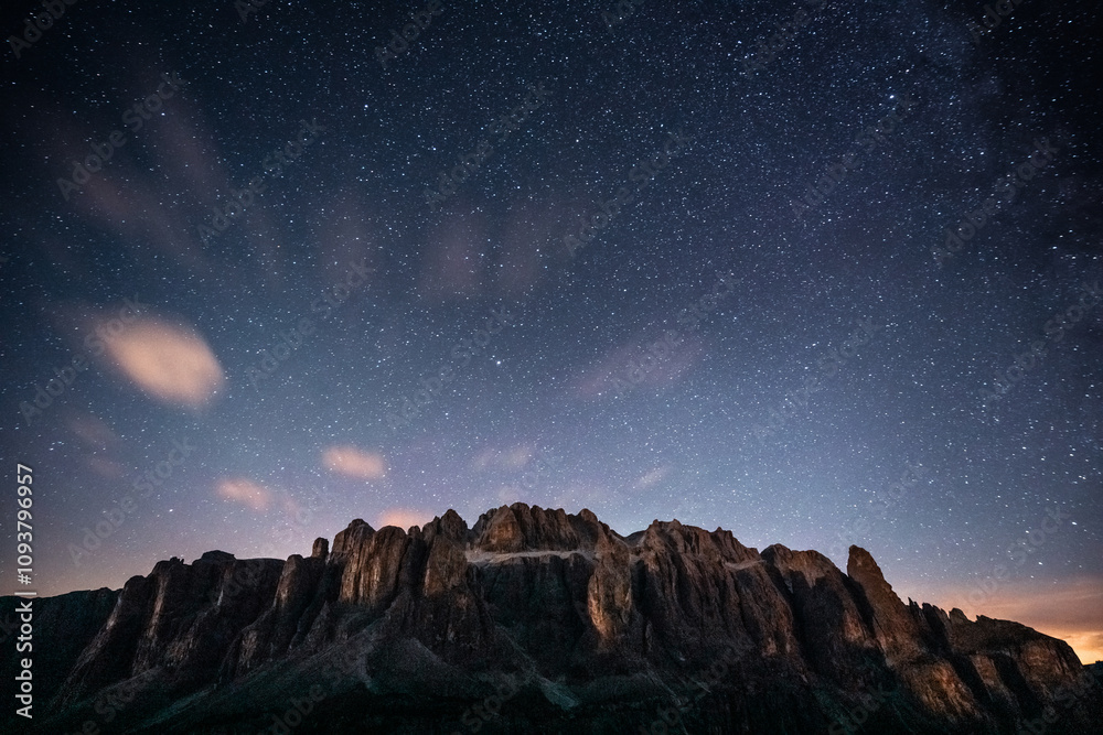 A beautiful starry night sky with a majestic mountain in the foreground A beautiful starry night sky with a majestic mountain in the foreground