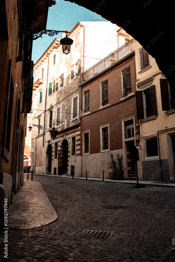 Fototapeta premium A narrow street features a manhole cover prominently situated in the middle