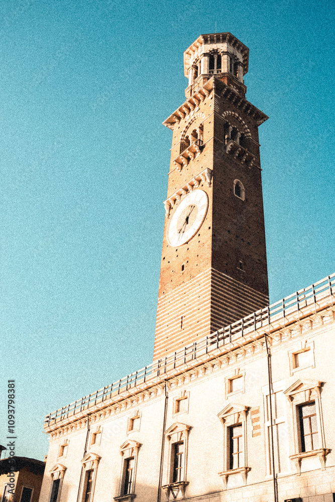 Fototapeta premium Clock tower atop a building with blue sky behind it