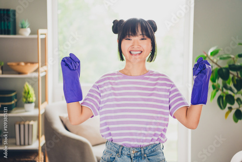 Photo of shiny lucky girl dressed purple striped t-shirt ready cleanup indoors house apartment room