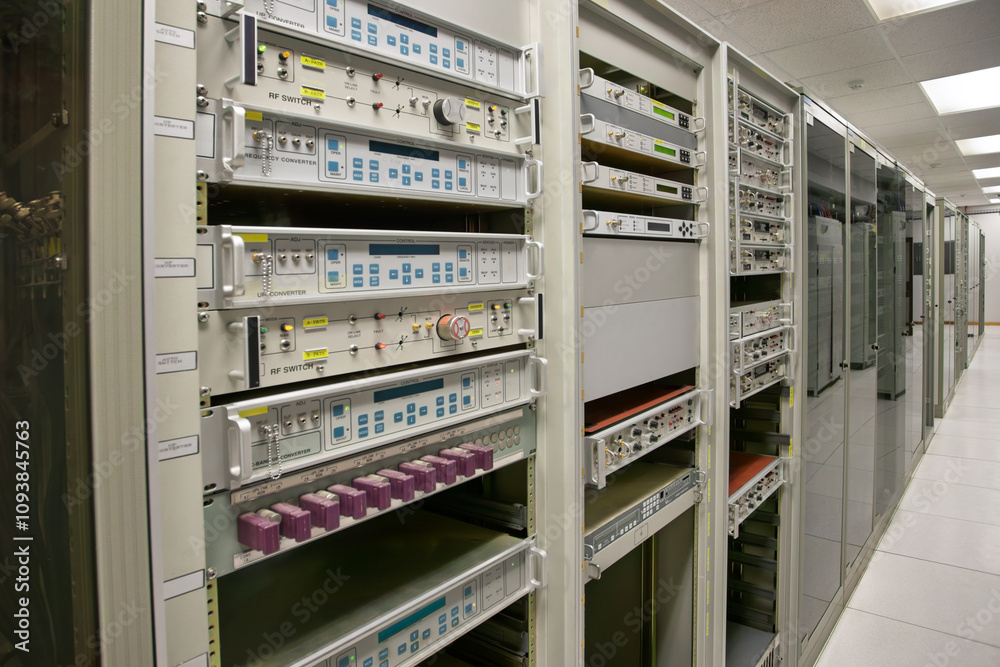 RF switch equipment frequency convertor in a data center, rack server, satellite connections equipment indoors at the station, emission analyzers RF switch equipment frequency convertor in a data center, rack server, satellite connections equipment indoors at the station, emission analyzers