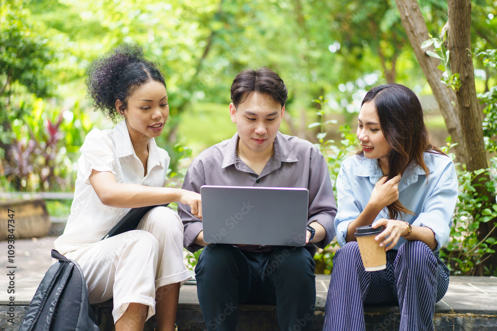Group of people working and talking at the park. Group of people working and talking at the park.