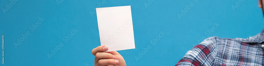 American Voter: A person's hand, holding up a single ballot, with a proud look on their face. American Voter: A person's hand, holding up a single ballot, with a proud look on their face.