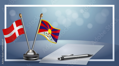 Denmark and Tibet National flags on small table with bokeh background, cooperative relationship