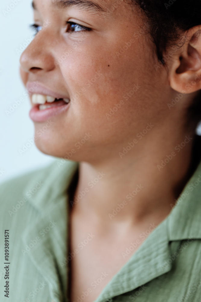 Joyful young boy with bright smile brushing teeth in close up view Joyful young boy with bright smile brushing teeth in close up view