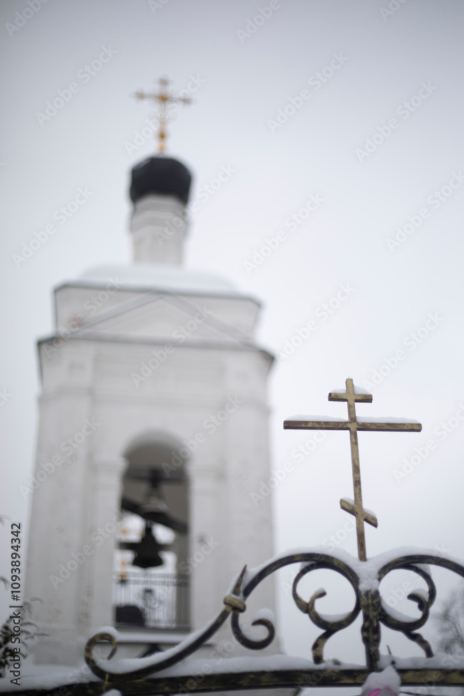Orthodox Church on a winter day. Ancient bell tower. Religious building. Orthodox Church on a winter day. Ancient bell tower. Religious building.