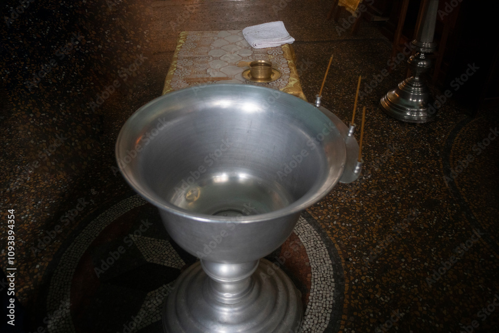 A bowl for the rite of baptism of an infant. A bowl with holy water in the Orthodox Church. A bowl for the rite of baptism of an infant. A bowl with holy water in the Orthodox Church.