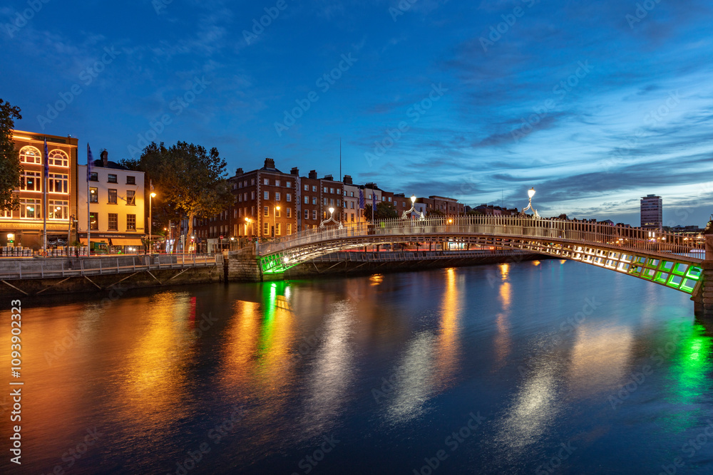 Historic Ha'Penny walking bridge over the River Liffey in Dublin, Ireland Historic Ha'Penny walking bridge over the River Liffey in Dublin, Ireland
