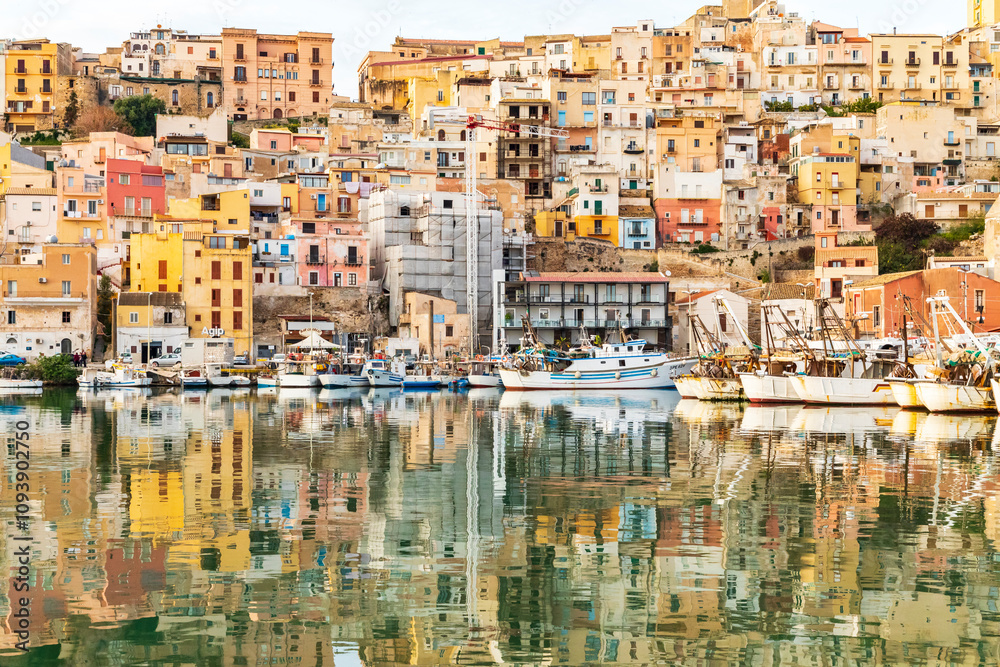 Italy, Sicily, Agrigento Province, Sciacca. April 16, 2019. Fishing boats in the harbor of Sciacca, on the Mediterranean Sea. Italy, Sicily, Agrigento Province, Sciacca. April 16, 2019. Fishing boats in the harbor of Sciacca, on the Mediterranean Sea.
