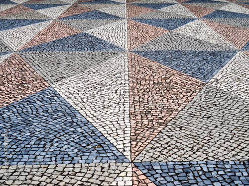 Portugal, Lisbon. Typical Portuguese colorful cobblestone pavement. photo