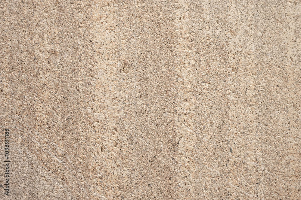 Fototapeta premium Close up detail of beige rough concrete wall texture. Design element use for background or backdrop in architecture and construction concept