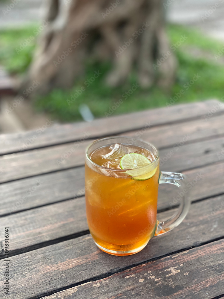 Refreshing Lemon Iced Tea in a Glass Mug Refreshing Lemon Iced Tea in a Glass Mug