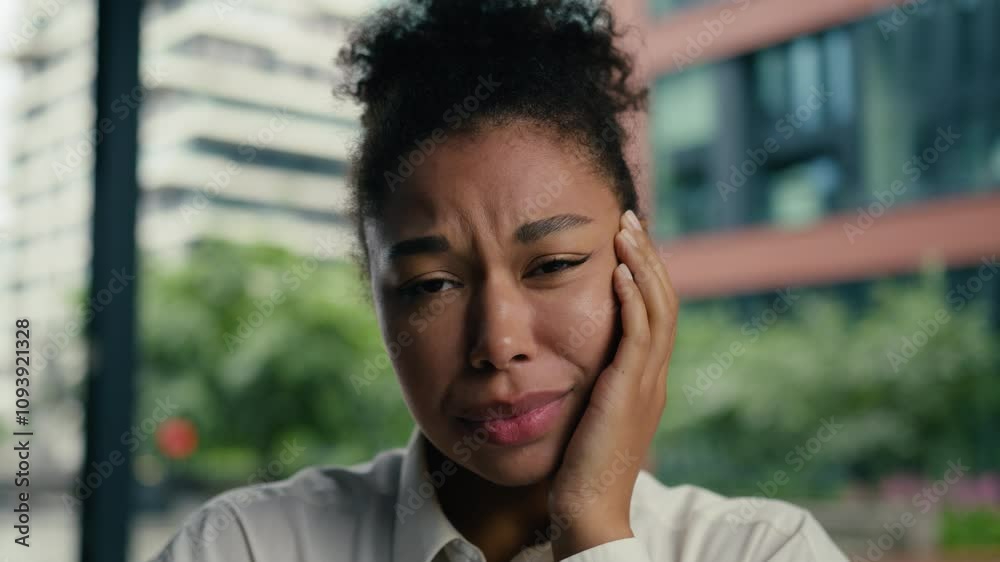 Face African American woman touch jaw toothache ill health dentistry patient female girl discomfort suffer sick caries dental ache teeth oral disease unwell unhappy businesswoman business city outside Face African American woman touch jaw toothache ill health dentistry patient female girl discomfort suffer sick caries dental ache teeth oral disease unwell unhappy businesswoman business city outside