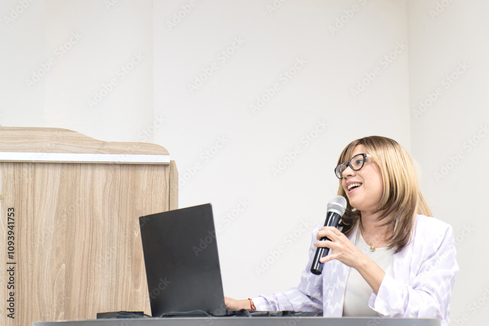 Featured speaker participating in an academic event using modern technology Featured speaker participating in an academic event using modern technology