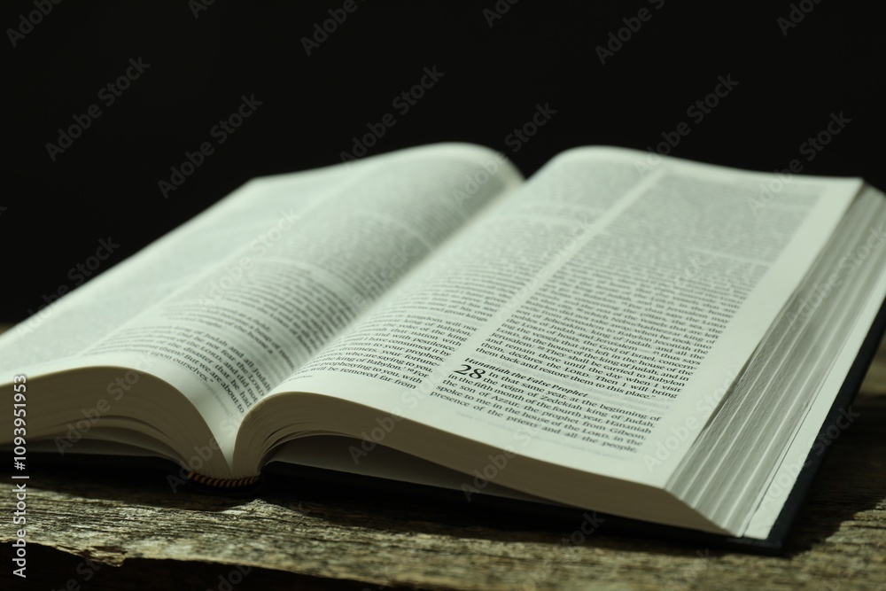 Open Holy Bible in English language on wooden table, closeup Open Holy Bible in English language on wooden table, closeup
