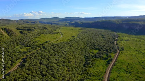 Cinematic stunning scenery and tranquil beauty of Hell's Gate National Park is filled with lush greenery, winding roads and breathtaking views in a peaceful natural setting. Drone footage from Kenya