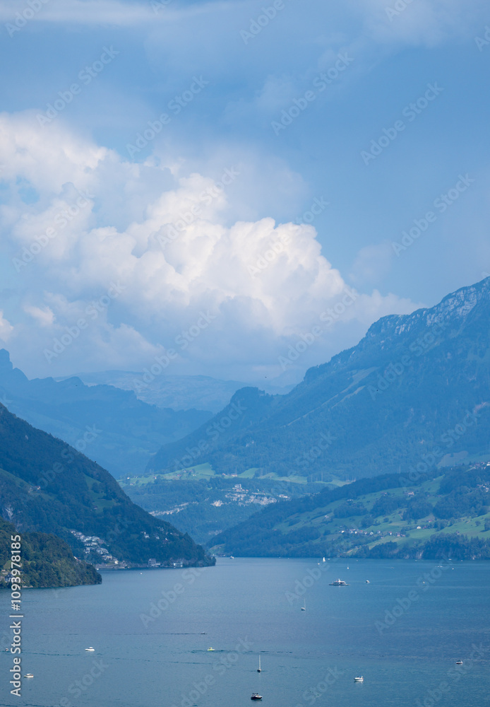 Obraz premium Alpine mountains and like in Switzerland. Hiking in the Swiss Alps mountains during summer, hiking trail in Switzerland. Lake in the Swiss Alps. Panoramic of the nature and mountains of Switzerland.