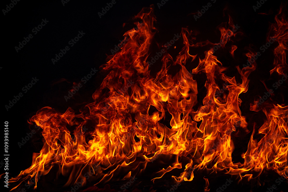 Fototapeta premium Fire flame burning and fire glowing on black background.