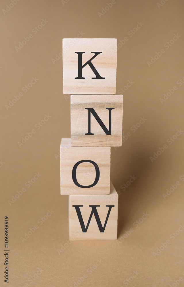 Stack of wooden blocks with the KNOW on them Stack of wooden blocks with the KNOW on them