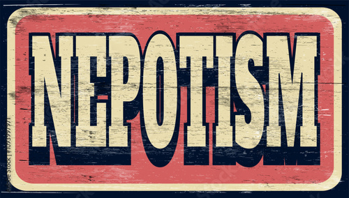 Aged and worn nepotism sign on wood