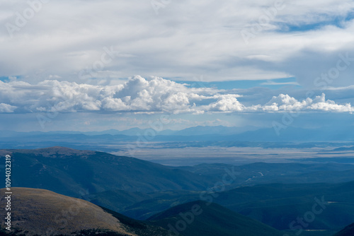 Photography Expansive view from the summit of a mountain in Colorado during late afternoon u