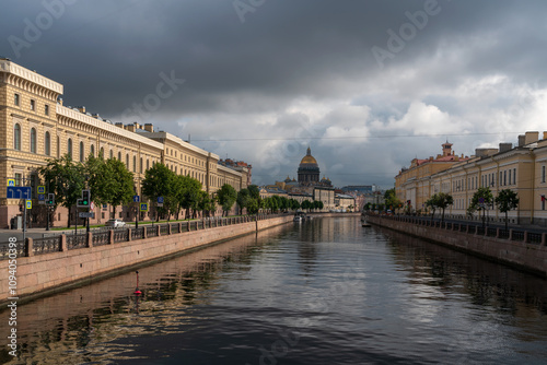 View of St. Isaac's Cathedral and the Moika River embankment on a sunny summer morning, St. Petersburg, Russia