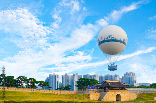 Fototapet Hwaseong fortress fortification wall view and city in background in Suwon South