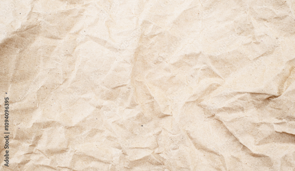 Recycled brown creased paper background from a paper packing. Crumpled brown paper texture concept Recycled brown creased paper background from a paper packing. Crumpled brown paper texture concept