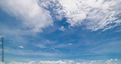 clear blue sky background,clouds with background, Blue sky background with tiny clouds. White fluffy clouds in the blue sky. 
Captivating stock photo featuring the mesmerizing beauty of the sky and cl photo