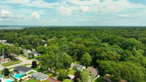 High altitude pan with Drone over Lush Trees. photo