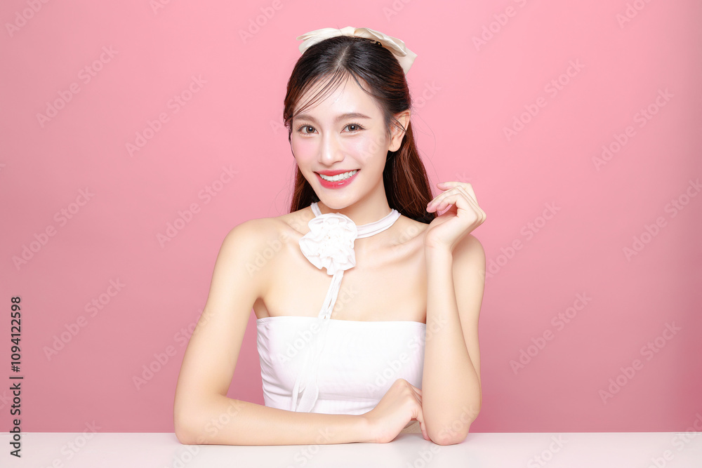 Pretty Asian woman model long hair perfect clear fresh skin smile on isolated pink background. Portrait elegant female beauty blogger make up artist in studio. Skincare, plastic surgery, spa concept. Pretty Asian woman model long hair perfect clear fresh skin smile on isolated pink background. Portrait elegant female beauty blogger make up artist in studio. Skincare, plastic surgery, spa concept.