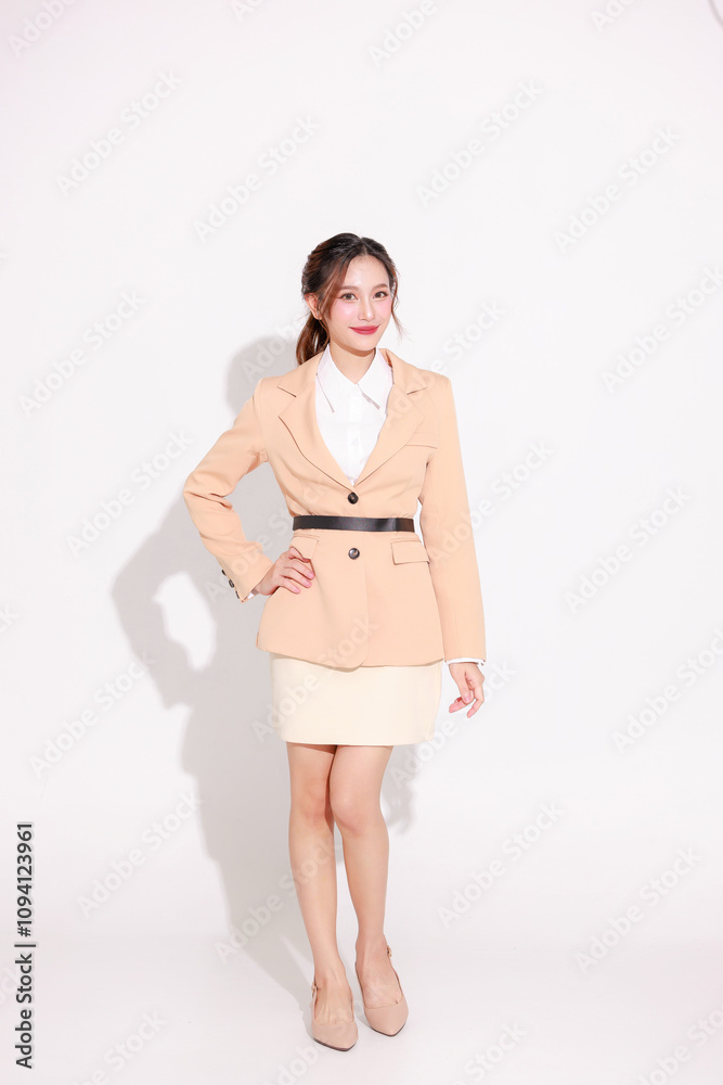 Smiling young Asian business woman leader entrepreneur wearing stylish suit doing various poses on isolated background. Smiling young Asian business woman leader entrepreneur wearing stylish suit doing various poses on isolated background.