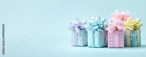 Colorful Gift Boxes with Bows on Blue Background for Celebrations and Holidays photo