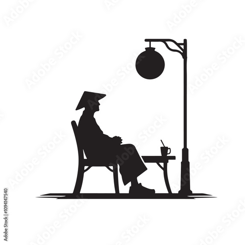 Silhouette of a person seated outdoors under a lamp post.eps