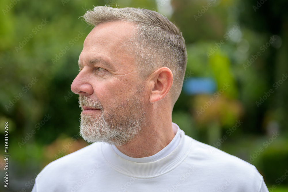 Side Profile of a Mature Man in a Natural Setting Side Profile of a Mature Man in a Natural Setting