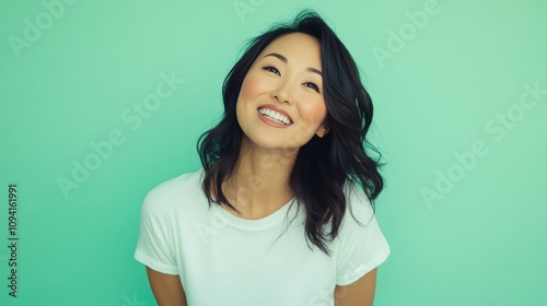 Happy Woman Smiling Against A Green Background