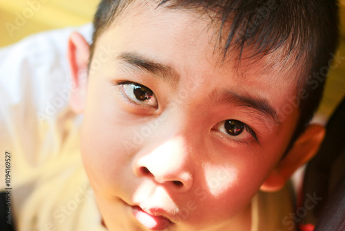 The innocent eyes of a boy.