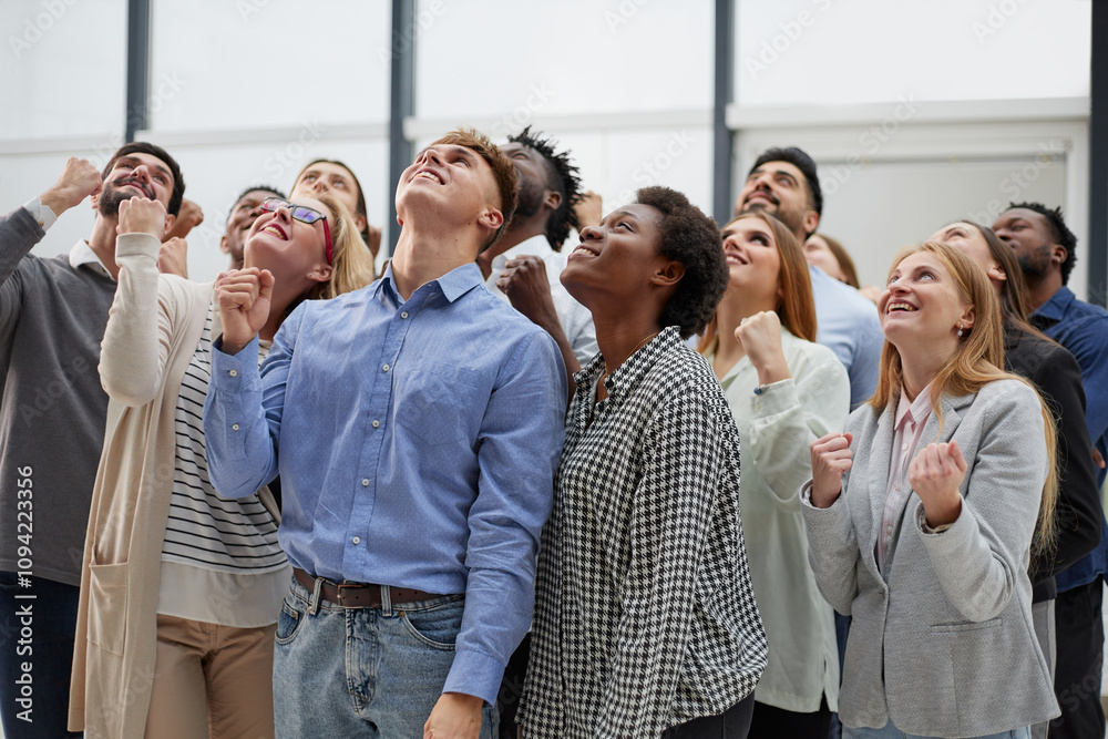 Happy people raise their hands up clenching their fists. Happy people raise their hands up clenching their fists.