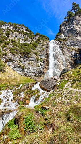 dalfazer waterfall during Spring time with deep blue background sky photo