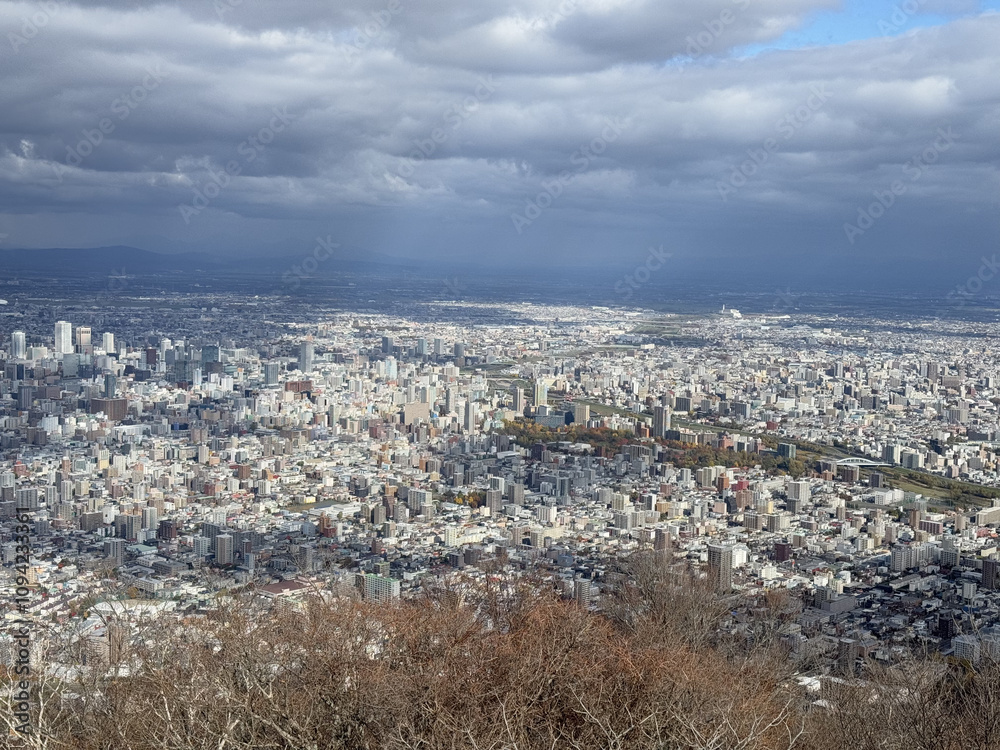 Obraz premium HeIght view with panoramic scenery in Sapporo Japan. Moiwa Ropeway with blur sky and cloudy