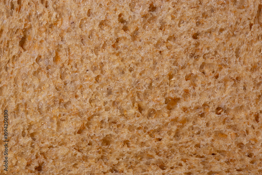 Slice of wholemeal brown bread background backdrop close up. Healthy food diet concept. Slice of wholemeal brown bread background backdrop close up. Healthy food diet concept.