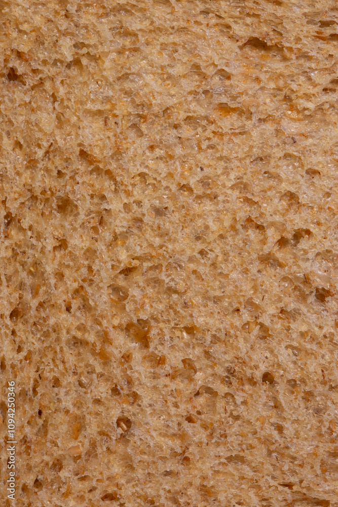 Slice of wholemeal brown bread background backdrop close up. Healthy food diet concept. Slice of wholemeal brown bread background backdrop close up. Healthy food diet concept.