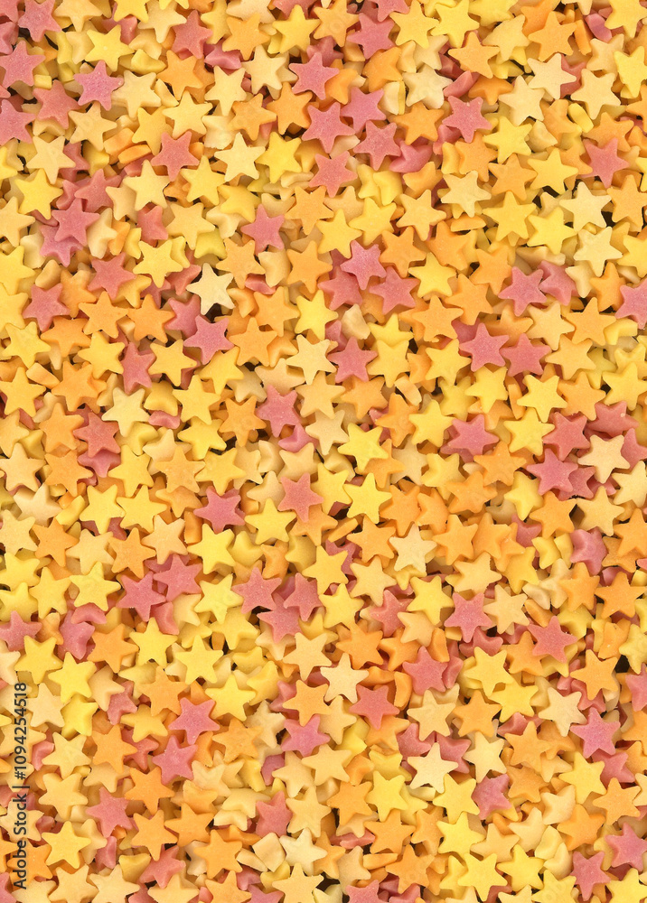 Multi coloured star shaped sugar cake decorations background Multi coloured star shaped sugar cake decorations background